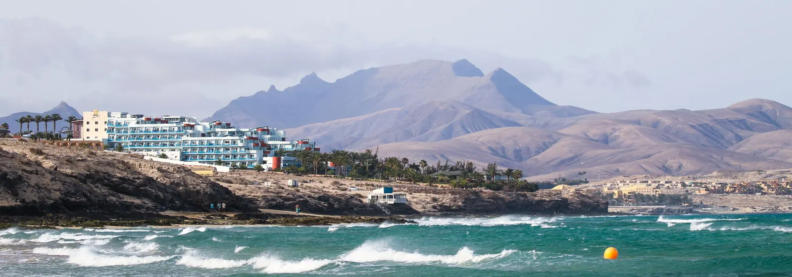 Fuerteventura coastline with waves and mountains