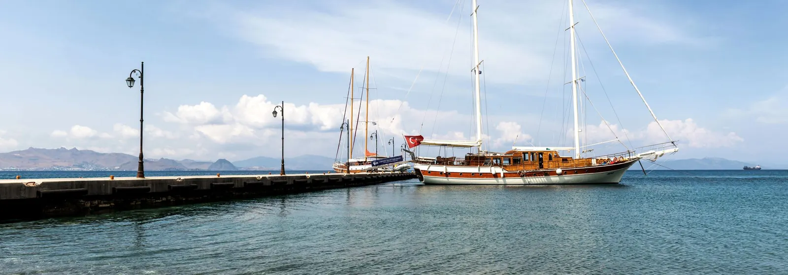 A sailboat moored at a pier on Kos
